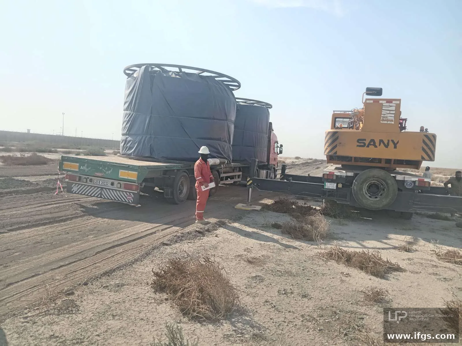 Iraq site truck and crane unload of RTP reel
